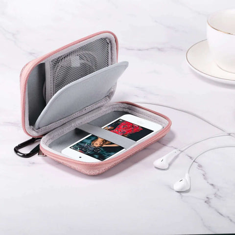 Heavy Duty Fly Pink Glitter MP3 And MP4 Player Case Grab And Go Travel Bag For Ipod Touch Drop Proof Guard Cable Organizer Electronic Accessory Pouch Storage Vault open with earphones.