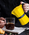 Pouring coffee from Bold Yellow Stovetop Moka Pot Espresso Maker 300 Ml Cup for Home Barista Quality Coffee Percolator