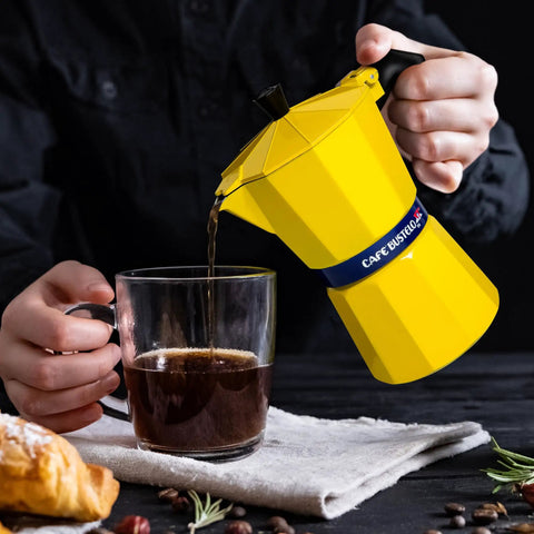 Pouring coffee from Bold Yellow Stovetop Moka Pot Espresso Maker 300 Ml Cup for Home Barista Quality Coffee Percolator