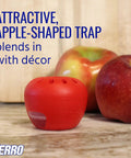 Red apple-shaped Indoor Fruit Fly Trap Kit With Built In Window Ready To Use, 2 Traps And 90 Day Lure Supply on a counter.