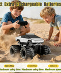 Two boys playing with Amphibious RC Car Scale 1 18 4WD All Terrain Off Road Pickup Beast on sandy terrain
