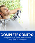 Man relaxing in room with Programmable Touchscreen Thermostat For Easy Home Comfort And Energy Savings, enjoying cozy temperature