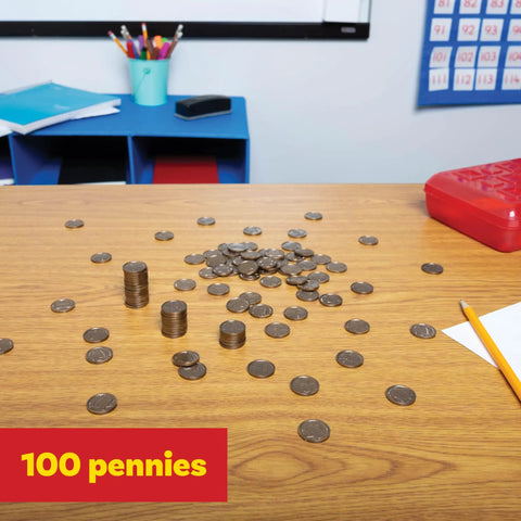 Play Pennies Set Of 100 Plastic Coins Realistic US Currency on classroom table for hands-on money math practice.