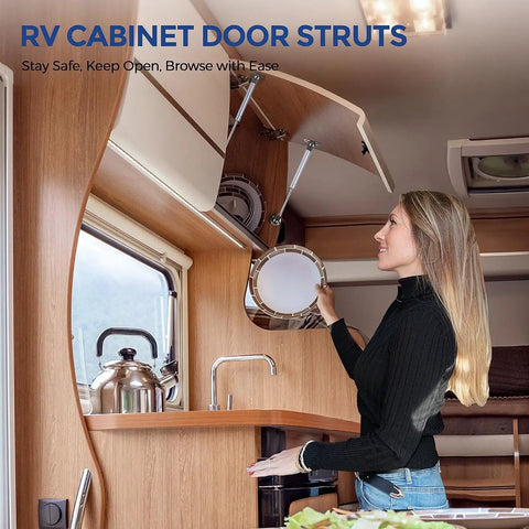 Woman using 10 Inch Gas Struts For Cabinets, Soft Open And Soft Close Lid Supports, in an RV kitchen cabinet, durable silver.