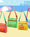 Mesh Beach Bags For Shells Collecting 4 Pack in bright colors with adjustable straps on a beach background.