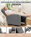 Woman relaxing on ultra comfy massage recliner chair for adults with adjustable 90 to 160 degree recline, gray fabric, living room.