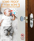 Baby sleeping soundly on a blanket with a door handle and soundproofing pad, promoting a quiet home environment.