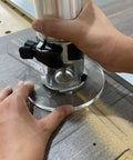 Person using a router with Six Inch Round Clear Acrylic Router Base Plate Straight Swap For RT0701C Or XTR01Z Models.