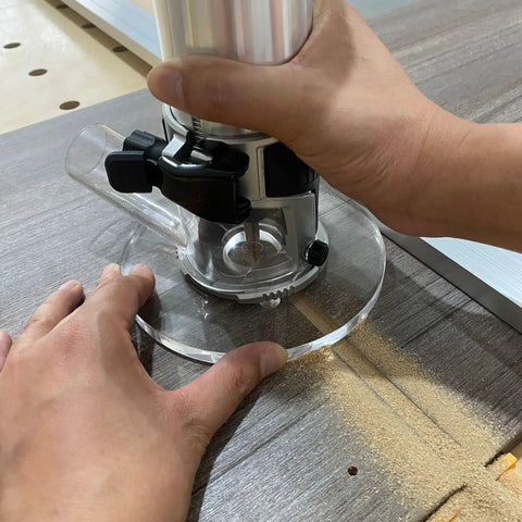 Person using a router with Six Inch Round Clear Acrylic Router Base Plate Straight Swap For RT0701C Or XTR01Z Models.