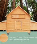 Front view of Mobile Wooden Chicken Coop On Wheels For Four To Six Chickens in a forested setting, showcasing fir wood and eco-friendly paint.