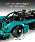 Close-up of Aston Martin Valkyrie Dope Building Kit showcasing the steering knob and working gears for kids 9 plus.