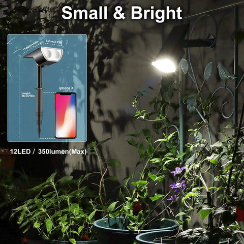 Solar Spotlight Pack Outdoor 12 LED IP67 Waterproof Dusk To Dawn Auto On Off 2In1 Adjustable Solar Powered Wall Lights illuminating plants.