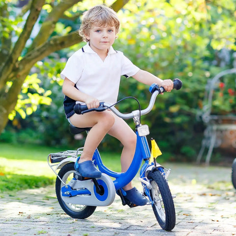 Child riding blue bicycle outdoors