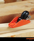 Front view of orange Jorgensen No.101 mini wood plane with black handle for trimming wood