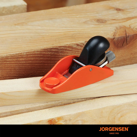 Front view of orange Jorgensen No.101 mini wood plane with black handle for trimming wood