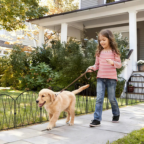 Girl walking dog along path bordered by 24 Pack Dope Decorative Garden Fence Barrier For Dogs And Rabbits, No Dig Arched Metal Border.