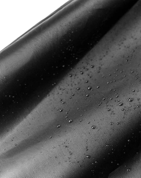 Heavy Duty Dustproof Miter Saw Cover Crafted With Tough 210D Oxford Fabric showing water-resistant surface with droplets.