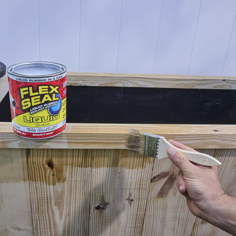 Person applying Liquid Rubber Coating Sealant for Waterproof, Flexible, UV Resistant Protection, DIY Ready 1 Gallon to wood