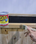 Liquid Rubber Coating Sealant For Roofs Basements RVs And Trailers Waterproof Flexible Breathable UV Resistant, 32 oz can next to wood surface