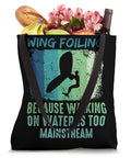 Retro Wing Foil Tote Bag for Wingsurfing Fans with Vintage Man on a Wingboard Design, holding groceries and flowers.