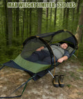 Person resting in Flat Lay Hammock Tent With Bug Net And Waterproof Rain Fly For One Person, setup in forest with weight text.