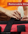 Person adjusting removable strap on Heavy Duty Lockout Tagout Bag, Large LOTO Tool Organizer for industrial use.