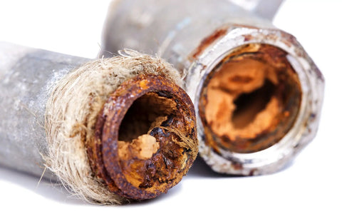 Rusty pipe with corroded opening, illustrating need for H2O OK Plus Complete Water Analysis Kit With 23 Tests for contaminants.