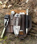 Leather EDC Multitool Sheath Belt Organizer for Daily Carry and Work Use with tools on tree bark