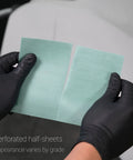 Flexible Polishing Sheets Starter Kit For Auto Detailing With K2000 To K3000 Grits 15 Sheets Plus Interface Pad And Hand Block Ultra Fast Cutting Power That Keeps Buffing Quick And Easy, showing two perforated half-sheets held by gloves