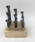 Quick Change Tool Post Holder Set Pro Grade With Nine Pieces Three Eighths Inch Boring Bar And Five Indexable Carbide Inserts Turning Tool Bits Kit For 7x10 7x12 And 7x14 Mini Lathes displayed on wooden stand