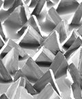 Close-up of Fiber Disc 987C 36 Plus Grit Ceramic Precision-Shaped Grain Metal Grinding Disc surface texture and grain triangles