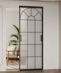 Hardcore Interior Sliding Barn Door Featuring Textured Reeded Glass Panels And Matte Black Frame Hidden Wall Track Kit Saves Wall Space And Moves Like Butter In Any Room Setup, showcasing modern design and functionality.