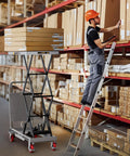 CAMMOO hydraulic lift table cart, gray, with scissor lift carrying stacked boxes in a warehouse.