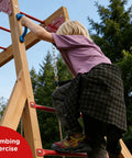 Child climbing on backyard playground swing set with monkey bar and belt swings for kids, outdoor playset with trapeze bar and climbing frame.