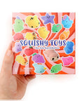 Premium Total Knockout 32 Pack Mochi Squishy Toys Kawaii Animals colorful packaging held, featuring soft squishy designs.