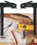 Badass 2 Pack Large Bench Holdfast Clamps 20mm Quick Acting Dog Hole Vise aluminum alloy clamps on a woodworking table with tools.