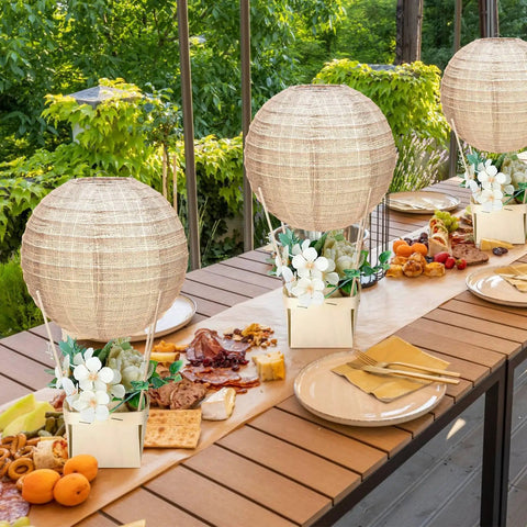 12 Sets Burlap Paper Lanterns and Wooden Centerpieces Kit for Baby Shower and Wedding Decor on outdoor dining table.