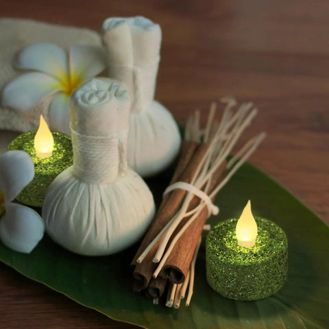 Green Glitter Flameless Tealight Candles 1.5 Inch By 1.65 Inch, Warm White LED Flicker, set with spa elements on leaf