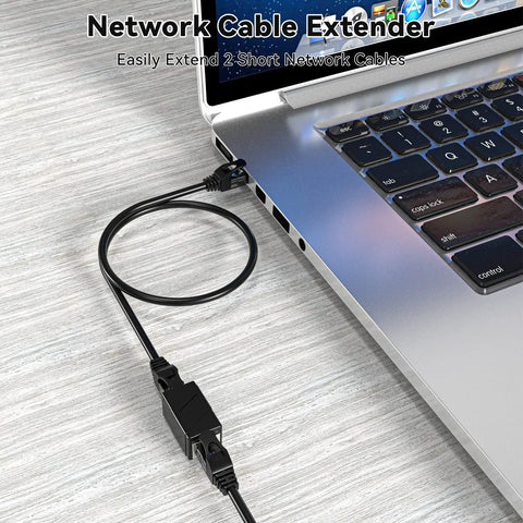 Two Pack Ethernet Couplers To Extend Your Cables Female To Female RJ45 Patch Cable Extenders connected to laptop