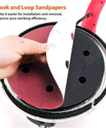 Close-up of Electric Drywall Sander With Vacuum And LED Lights 750W showing hook and loop sandpaper being attached.