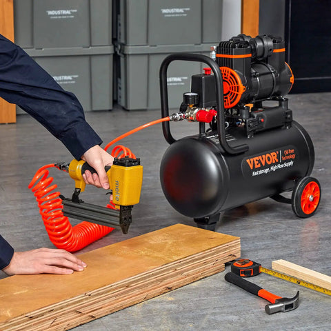 Ultra Quiet 4.8 Gallon Oil-Free Air Compressor With 1.2HP Motor Delivers 2.2 CFM At 90 PSI And 116 PSI Max connected to a nail gun