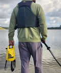 Man by lake holding All In One Boating Safety Dry Bag Kit With IP68 Waterproof Flashlight, C1004 Visual Distress Signal.