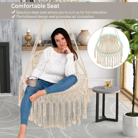 Macrame Swing Chair For Indoor Outdoor Living, Heavy Duty Hanging Porch Swing With Soft Cushions, Cotton Rope And Hardware Kits, Supports Up To 330 Lbs, Oval Hammock Style Chair For Patio Balcony Beige in living room