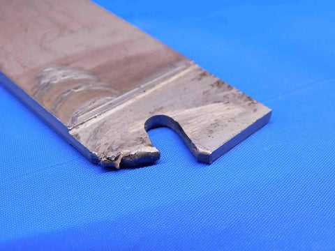 Self-Grip SGIH 32-5 Double Ended Cutoff Blade for Parting and Grooving, 5 7/8 Inch Overall Length, Built for Pros and Die Work, Smooth Clean Cuts, Heavy Duty Precision Tool, BR5710BH3 close-up of worn metal cutting edge