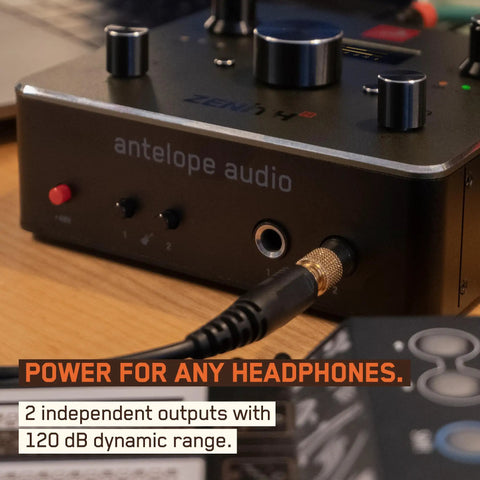 Close-up view of Zenith 2 USB C Audio Interface with 2 headphone outputs on wooden table.