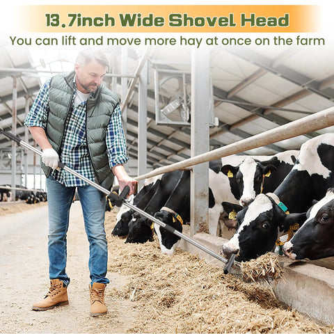 Man using Heavy Duty Metal Manure Fork With Two Replaceable Durafork Heads And Steel Handle Rustproof Hay Pitch Fork in barn