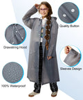 Model wearing gray poncho from 14 Pack Reusable EVA Rain Ponchos for Adults with Drawstring Hoods Waterproof Rain Gear for Women and Men