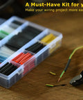 670 Piece Heat Shrink Tubing Kit With Wire Stripper Cutter on wooden table, showcasing 6 colors and assorted sizes for DIY projects.