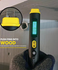 Handy Pin Style Moisture Meter For Wood And Drywall With Tri Color LCD used on wooden surface showing moisture reading