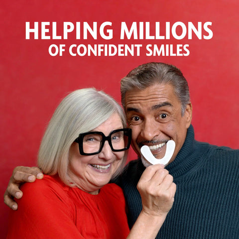 Couple smiling while holding Original Flavor Denture Adhesive Seal For Lower Dentures, Zinc Free, All Day Hold, 30 Count Pack
